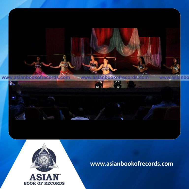 Longest Time Balancing a Wooden Cane Stick on Head while Performing Belly Dance by an Individual (Female)