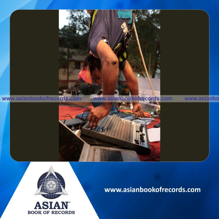 Longest Performance by Radio DJ Suspended Upside Down