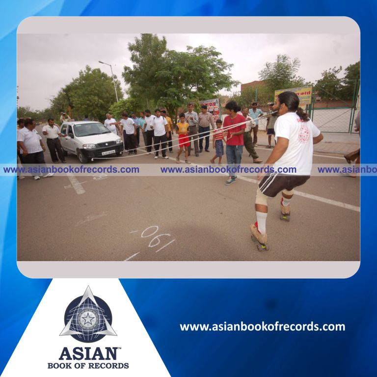 Longest Distance Pulling a Car with the Beard while Performing Roller Skates Simultaneously by an Individual (Male)