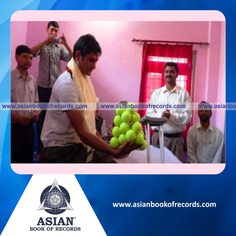 Highest Number of Tennis Balls Held in One Hand by an Individual (Male)