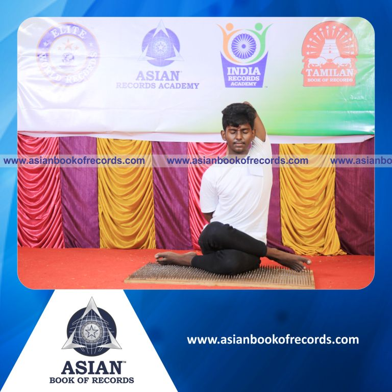 Highest Number of Three Digit by Single Digit Mental Arithmetic Division Problems (2 Rows) Solved in 10 Minutes while Performing Yoga on a Nail Bed Si