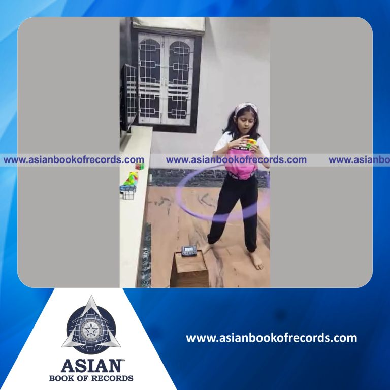 Maximum Different Types of Rubiks Cubes Solved while Performing Hula Hoop around Waist by an Individual (Minor-Female)