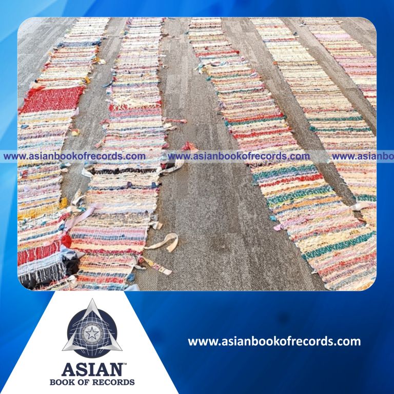 Highest Number of Participants Creating a Handwoven Tapestry Made of Recycled Fabrics