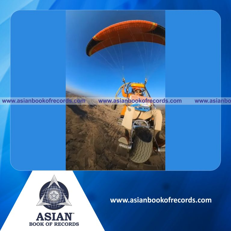 Highest Number of Slogans Displayed from the Highest Altitude to Spread Awareness of Road Safety (Through Paramotoring)