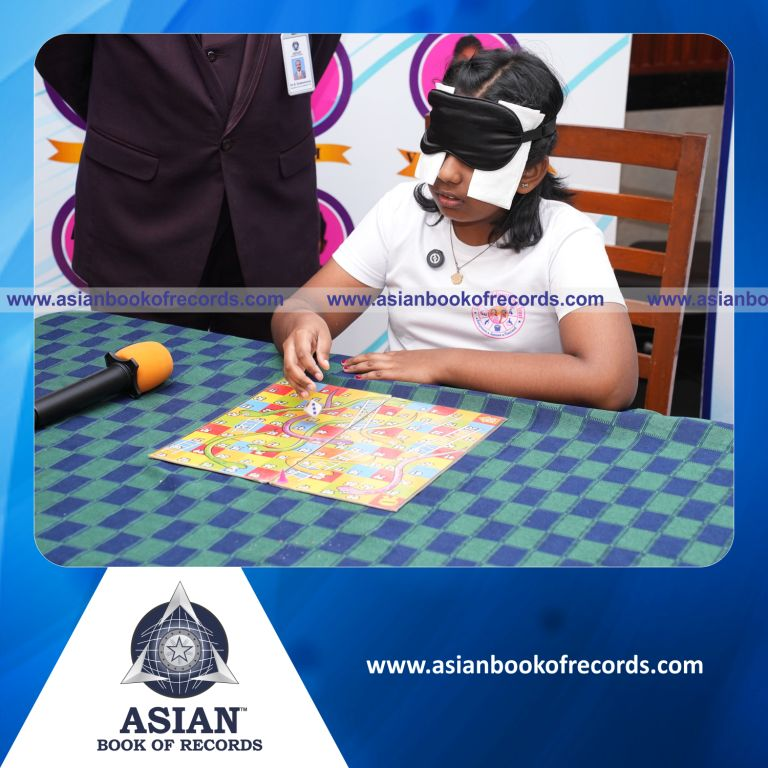 Fastest Time to Complete a Game of Snakes and Ladders while Blindfolded by an Individual (Minor – Female)